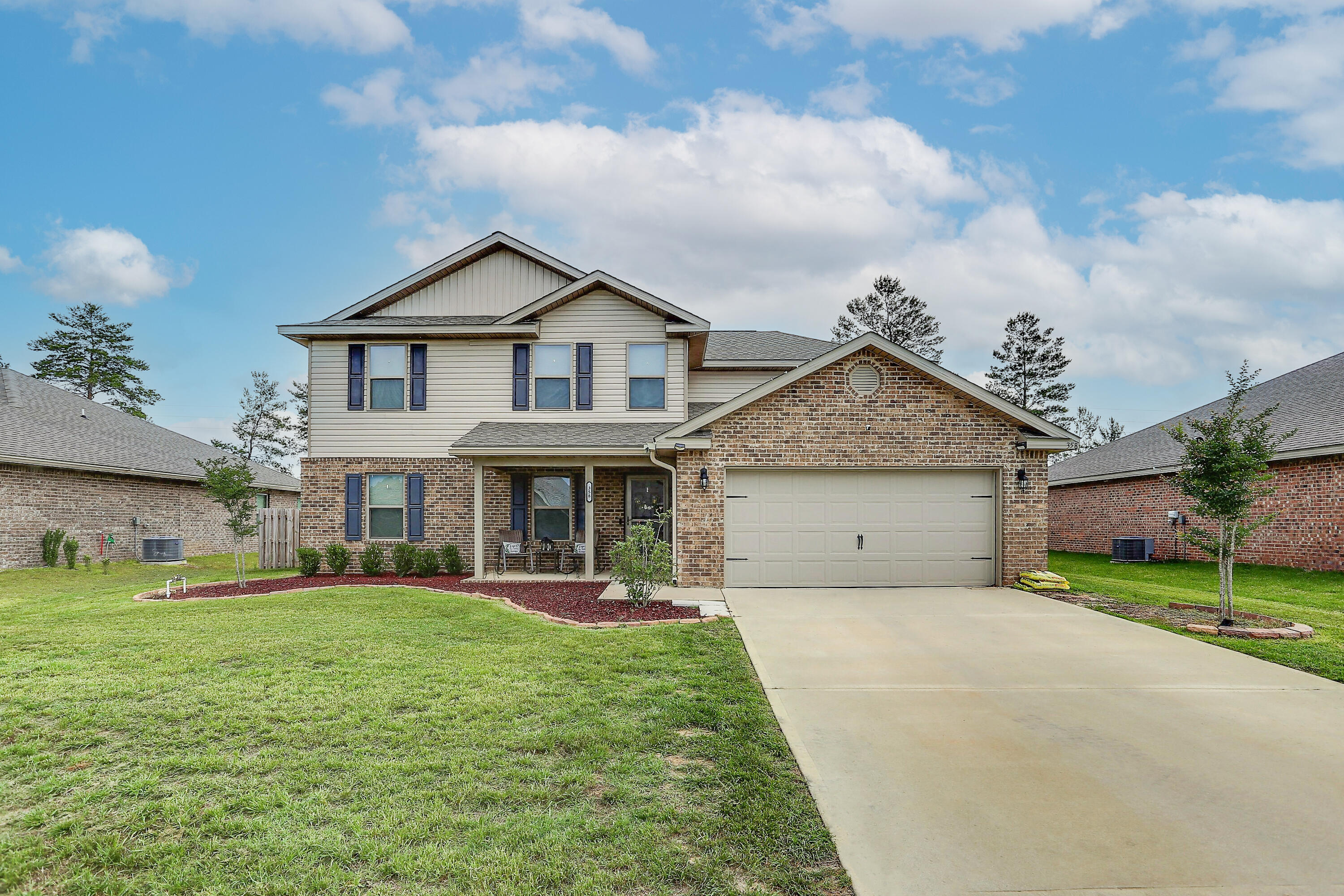 358 Merlin Court Crestview, FL 32539 - Photo 1 of 45 a view of a house with a yard potted plants and a yard