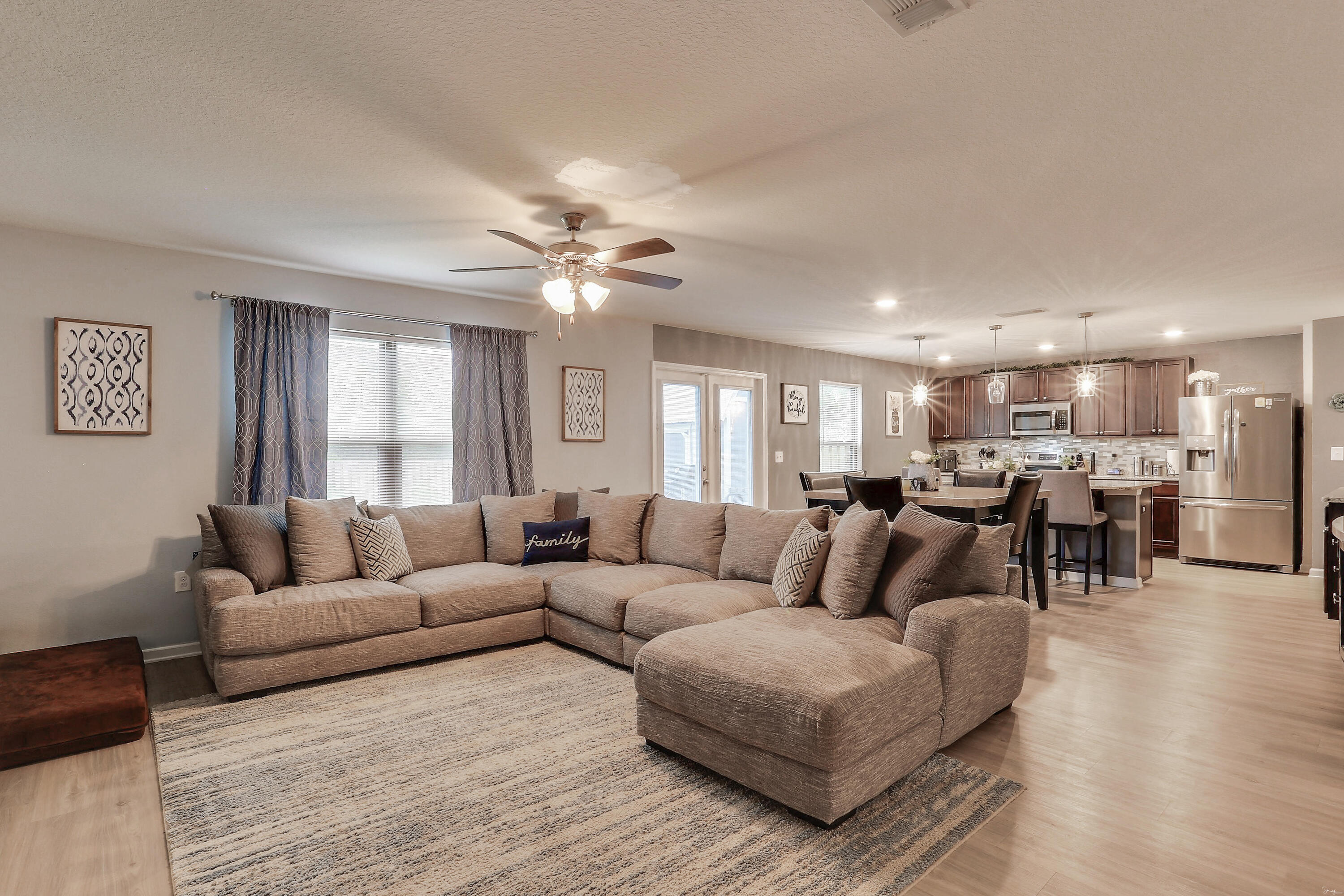358 Merlin Court Crestview, FL 32539 - Photo 11 of 45 a living room with furniture and a large window