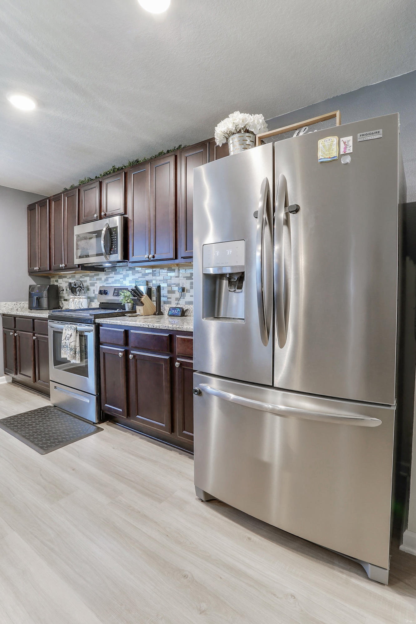 358 Merlin Court Crestview, FL 32539 - Photo 18 of 45 a kitchen with stainless steel appliances granite countertop a refrigerator a stove a sink and a refrigerator