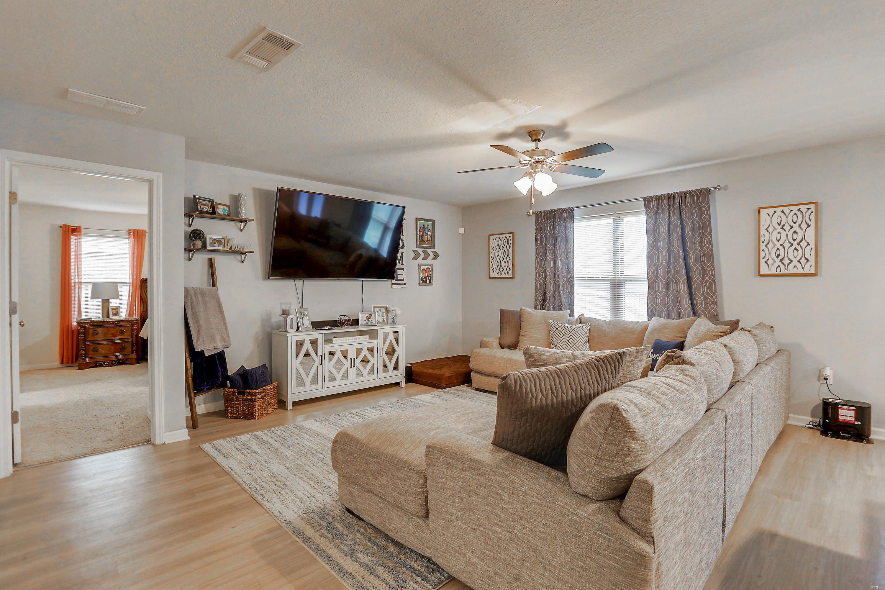 358 Merlin Court Crestview, FL 32539 - Photo 22 of 45 a living room with furniture and a flat screen tv
