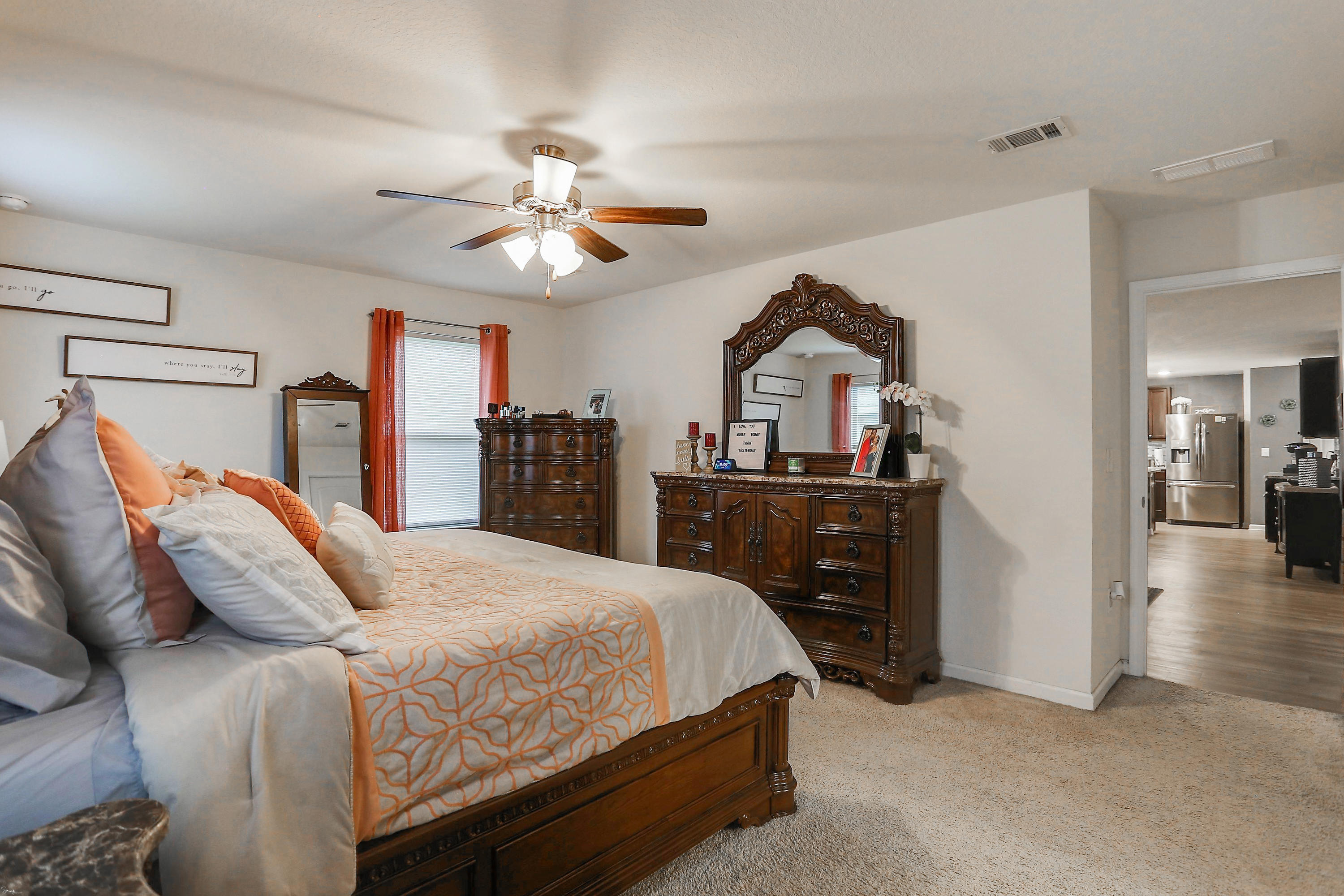 358 Merlin Court Crestview, FL 32539 - Photo 24 of 45 a bedroom with a bed and a chandelier