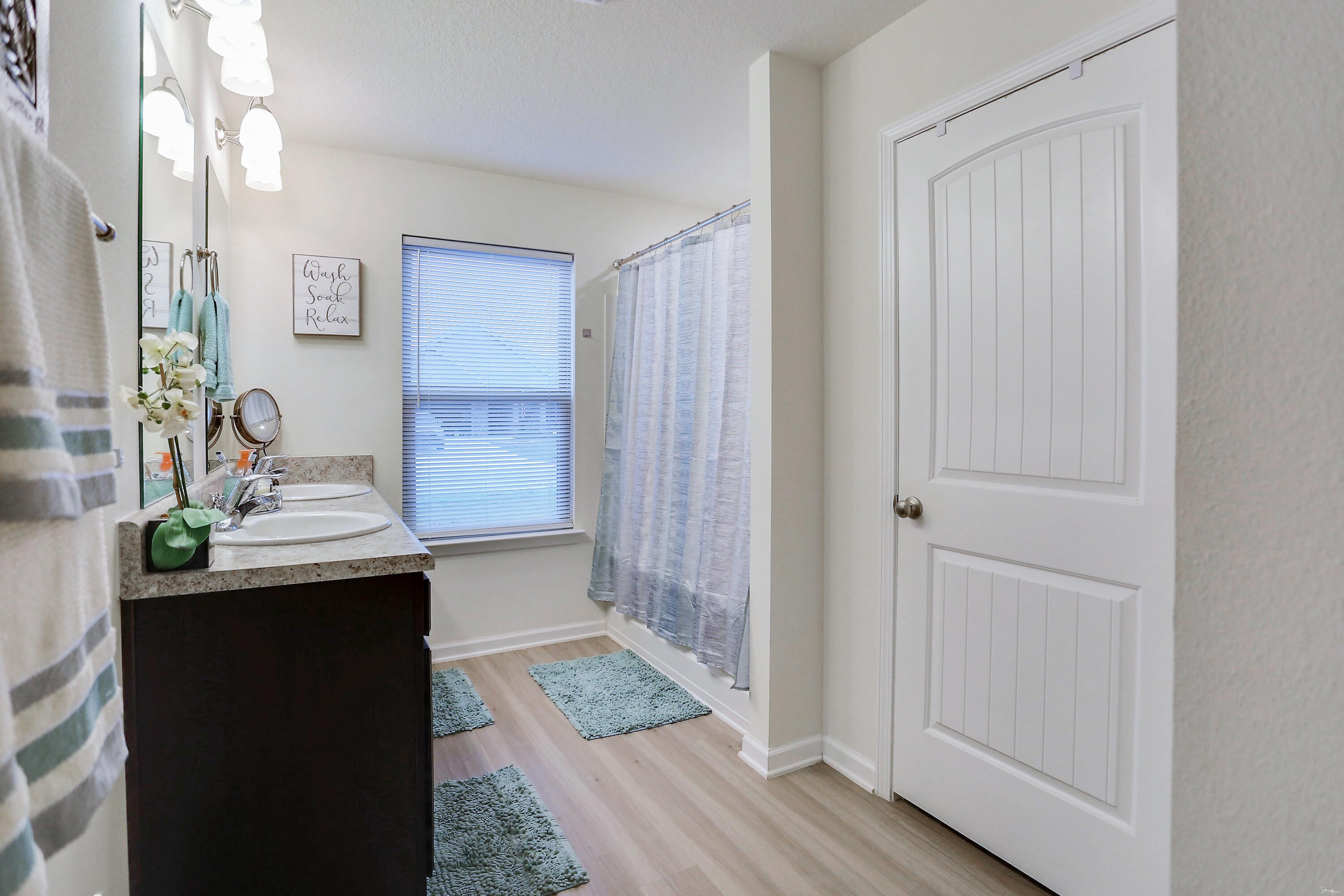 358 Merlin Court Crestview, FL 32539 - Photo 25 of 45 a bathroom with a sink and mirror