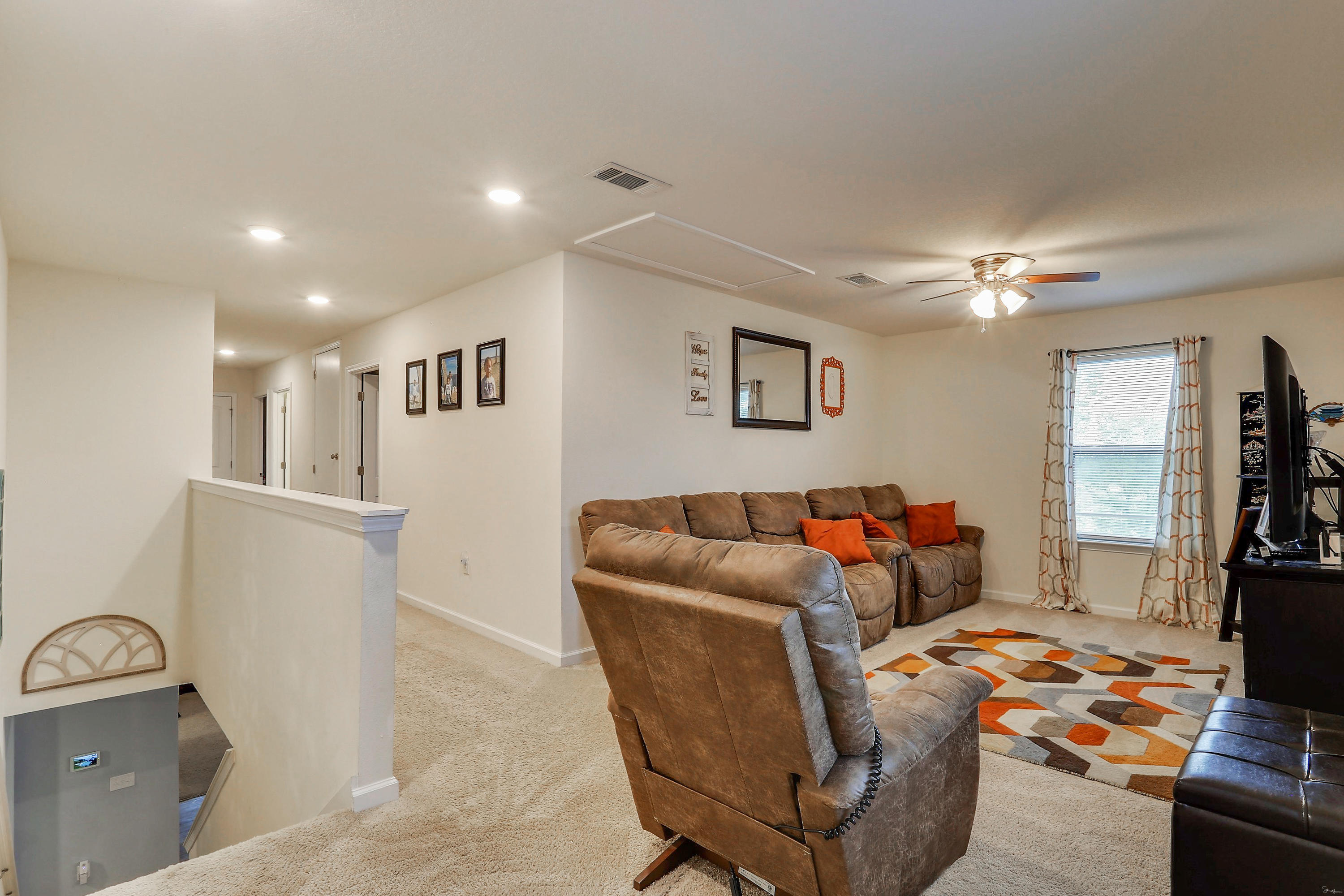 358 Merlin Court Crestview, FL 32539 - Photo 29 of 45 a living room with furniture and a flat screen tv