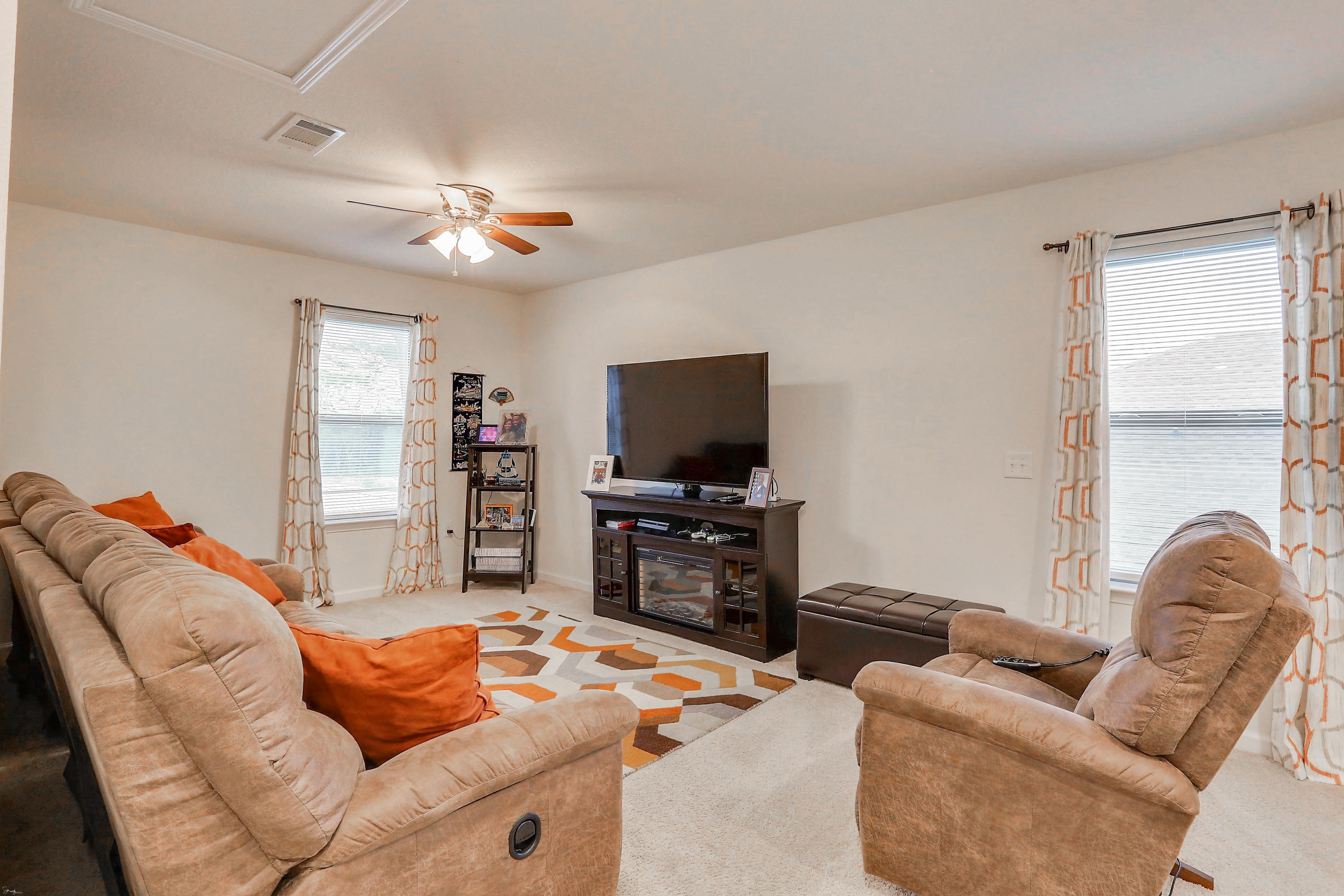 358 Merlin Court Crestview, FL 32539 - Photo 30 of 45 a living room with furniture and a flat screen tv