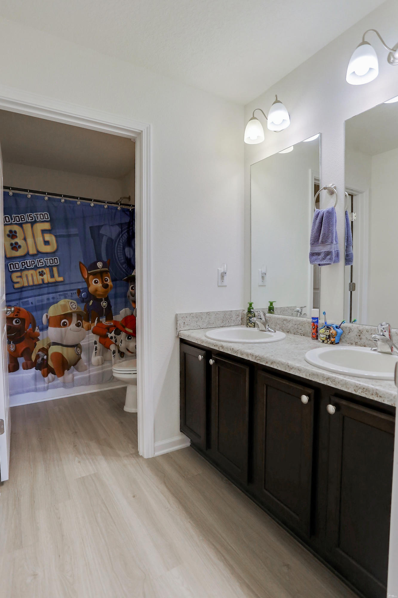 358 Merlin Court Crestview, FL 32539 - Photo 34 of 45 a bathroom with a sink double vanity and a mirror
