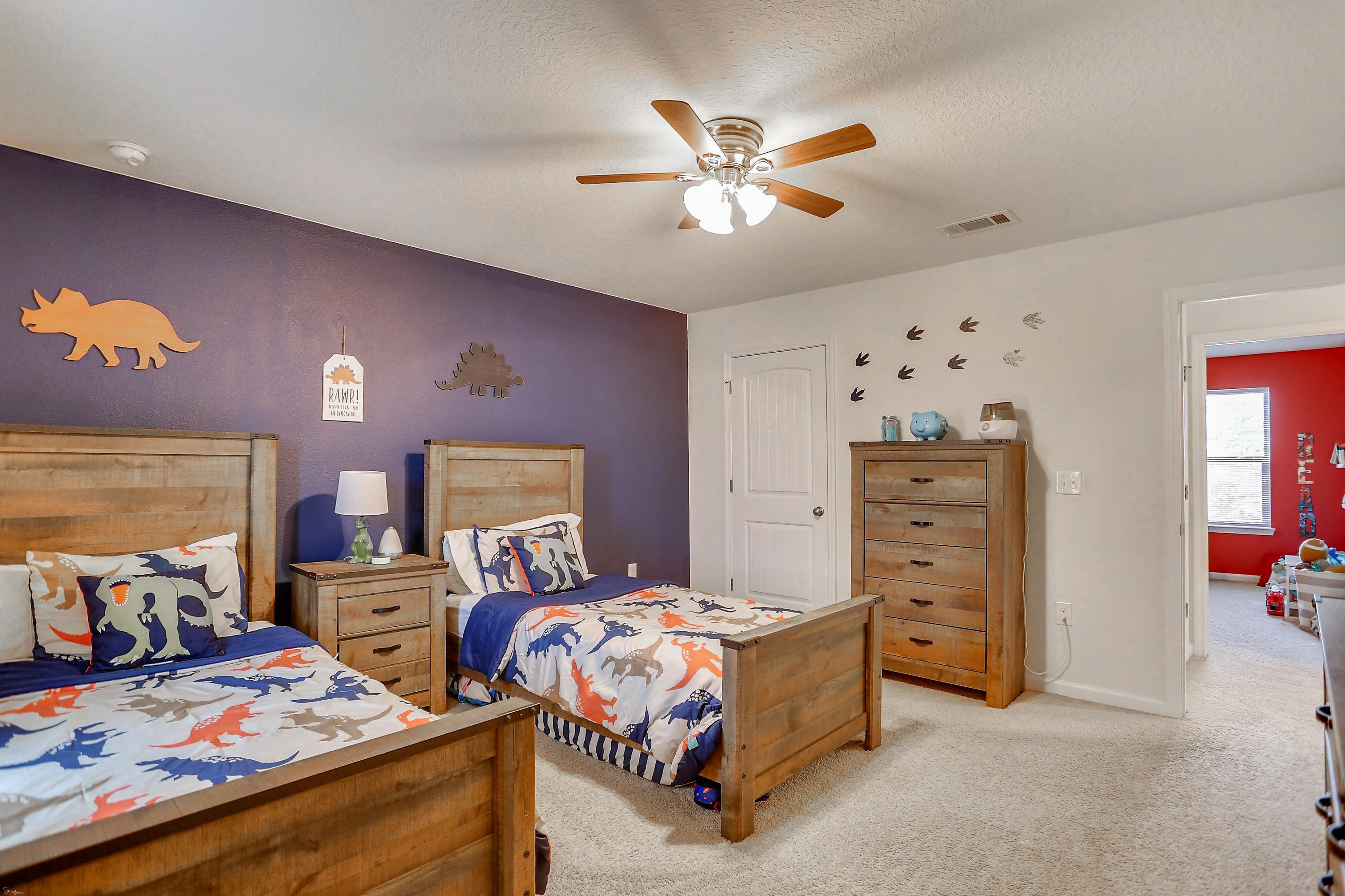 358 Merlin Court Crestview, FL 32539 - Photo 38 of 45 a bedroom with two beds and a chandelier
