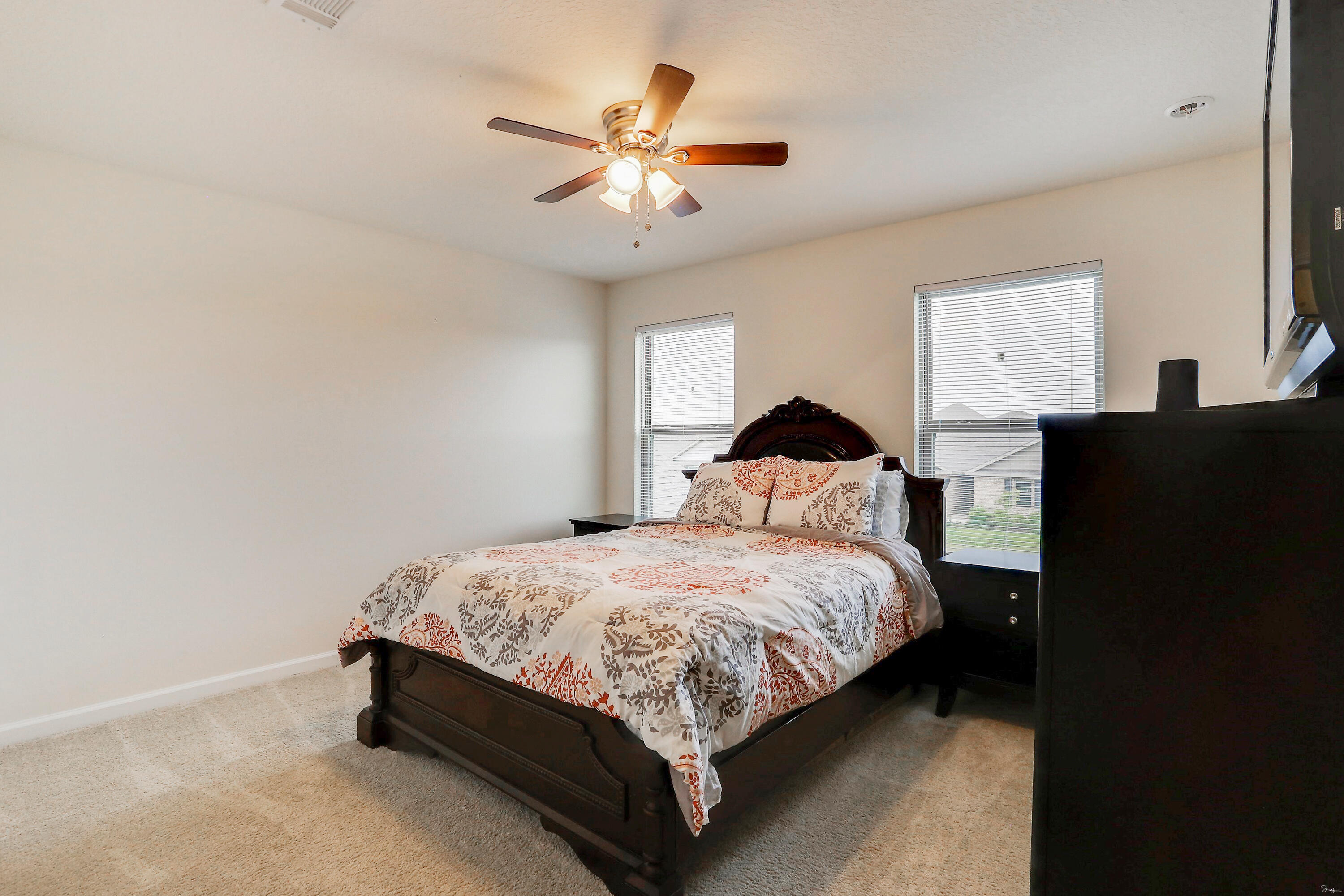 358 Merlin Court Crestview, FL 32539 - Photo 40 of 45 a bedroom with a bed and cabinet
