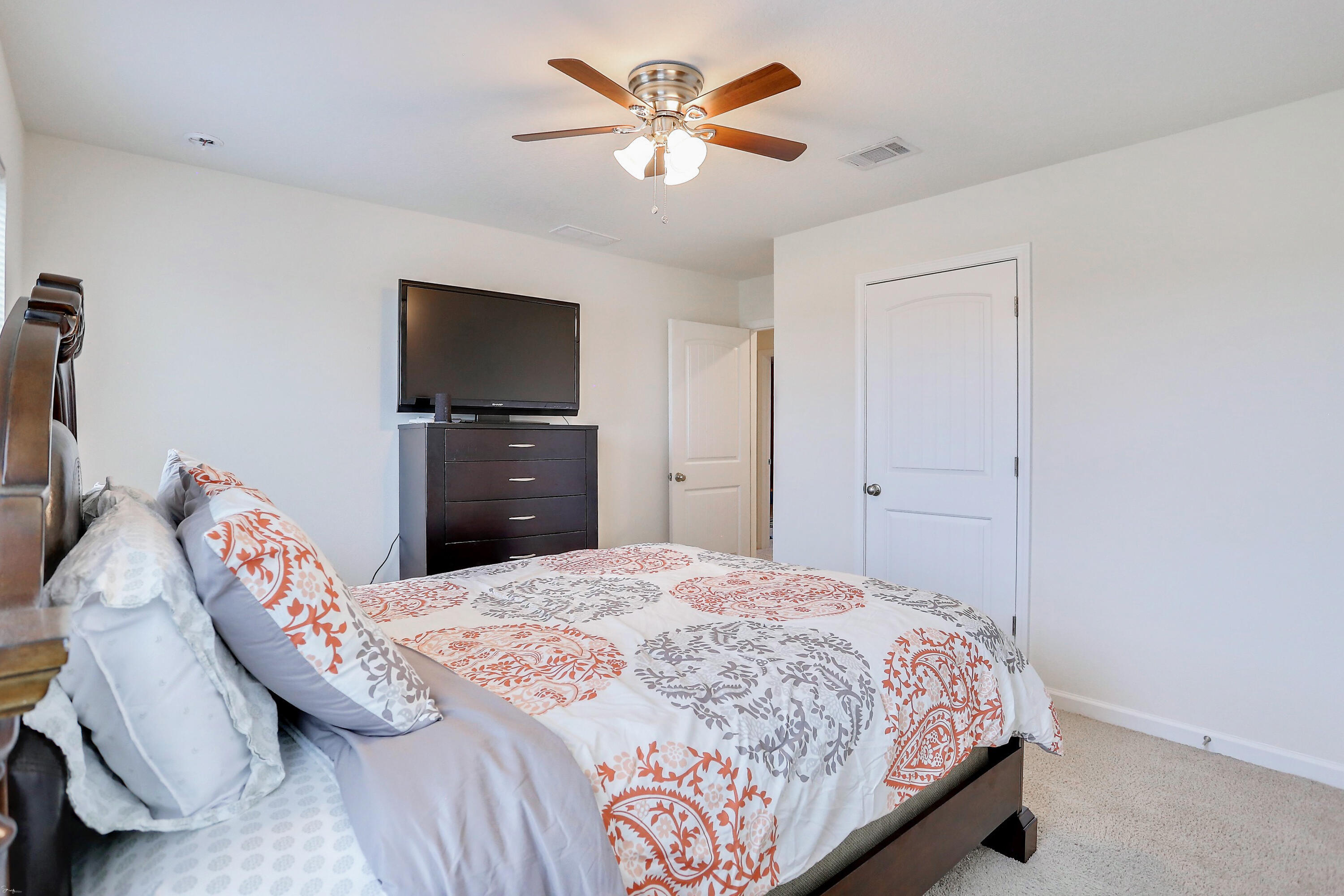 358 Merlin Court Crestview, FL 32539 - Photo 41 of 45 a bedroom with a bed and a chandelier