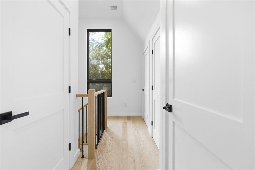 156 Albion Street, Unit R Somerville, MA 02144 - Photo 14 of 21 a view of a hallway with a white walls and stairs