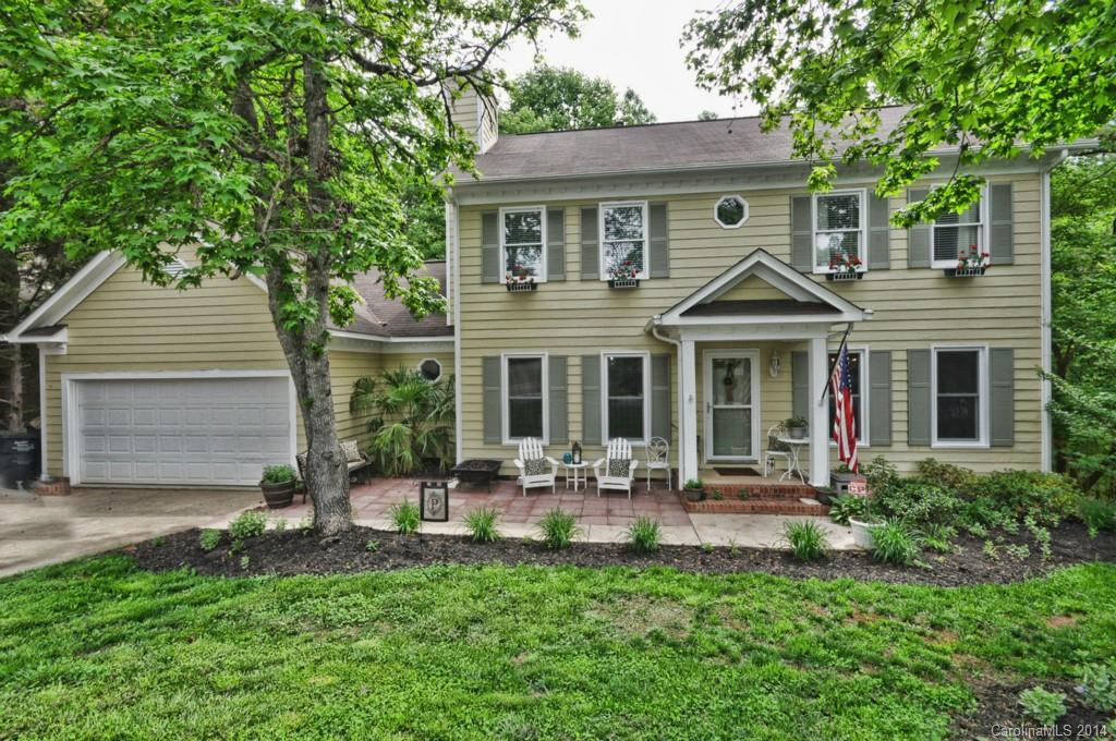 31017 Executive Point Tega Cay, SC 29708 - Photo 1 of 22 a front view of a house with garden