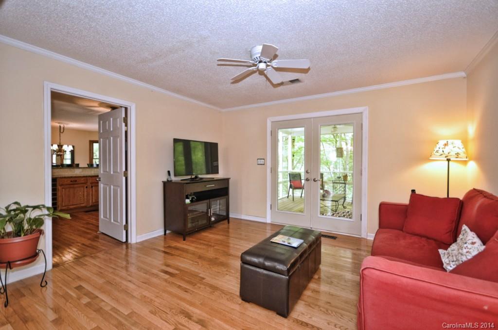31017 Executive Point Tega Cay, SC 29708 - Photo 11 of 22 a living room with furniture and a flat screen tv