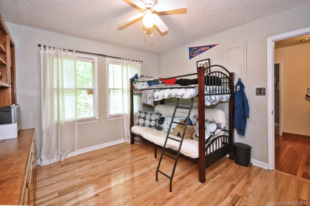 31017 Executive Point Tega Cay, SC 29708 - Photo 15 of 22 a bedroom with bunk bed and a window