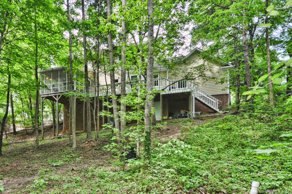 31017 Executive Point Tega Cay, SC 29708 - Photo 18 of 22 a backyard of a house with lots of green space