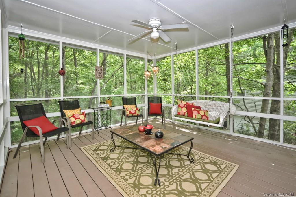 31017 Executive Point Tega Cay, SC 29708 - Photo 3 of 22 a living room with furniture and a large window