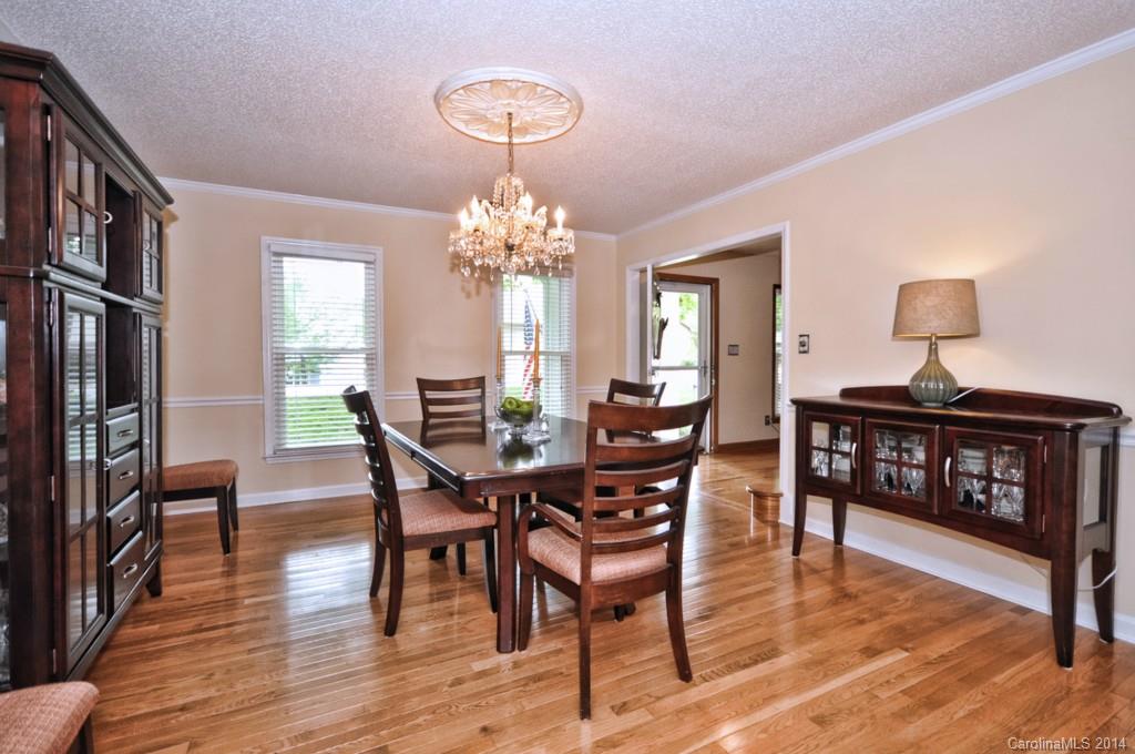 31017 Executive Point Tega Cay, SC 29708 - Photo 4 of 22 a view of a dining room with furniture and wooden floor