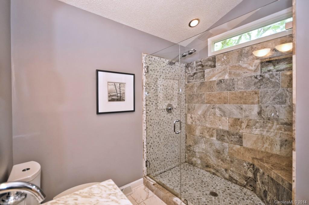 31017 Executive Point Tega Cay, SC 29708 - Photo 8 of 22 a bathroom with a shower