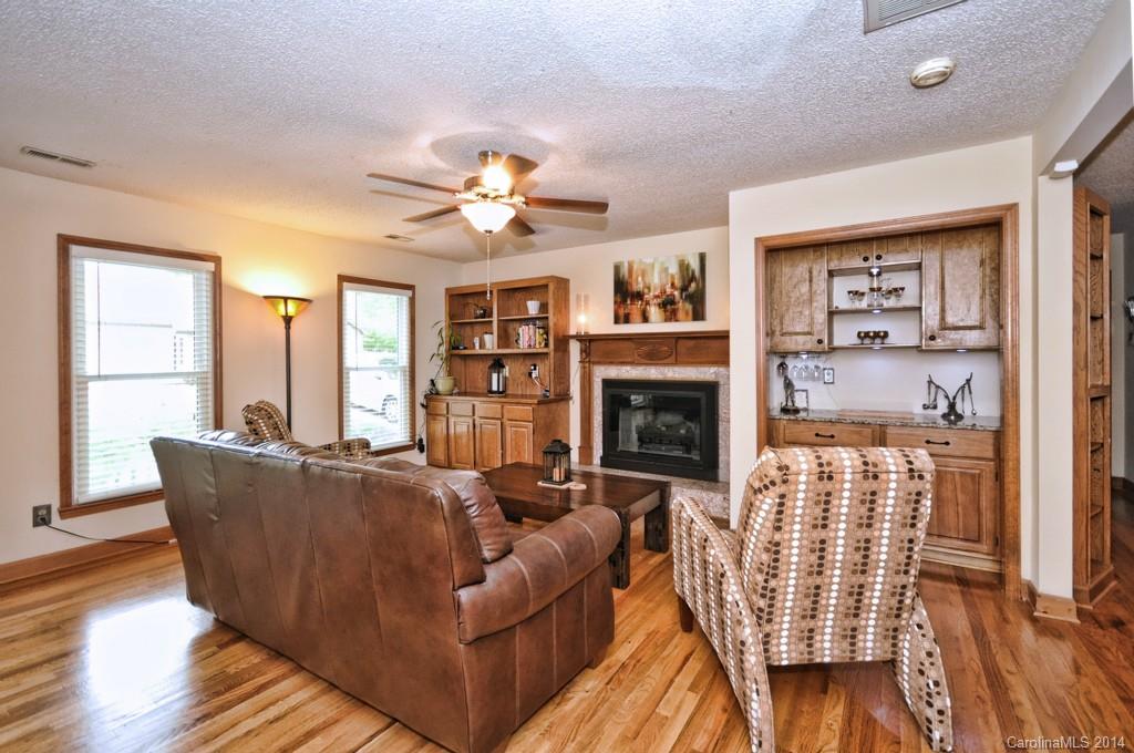 31017 Executive Point Tega Cay, SC 29708 - Photo 10 of 22 a living room with furniture and a fireplace