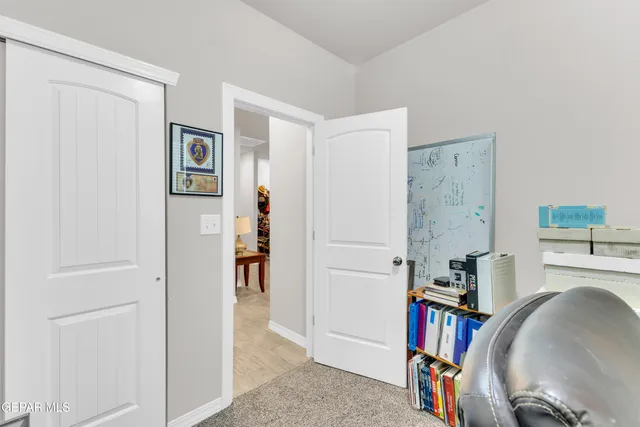 a view of a livingroom with furniture and an empty room