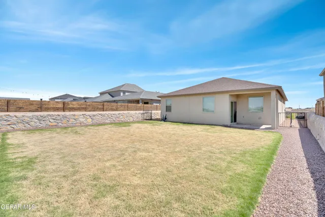 a house with swimming pool in front of it