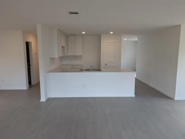 a white toilet sitting next to a shower