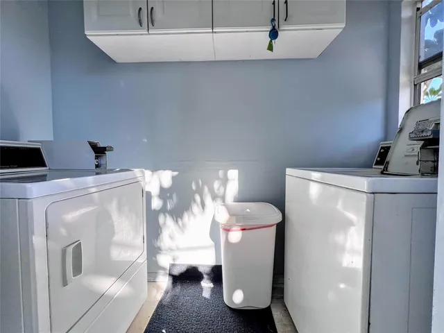 a bathroom with a sink mirror and toilet