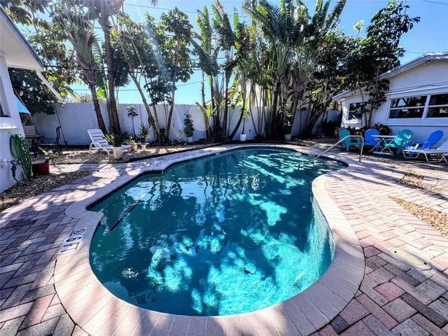 a view of a swimming pool with an outdoor space