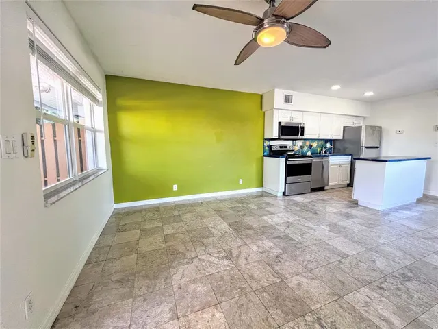 a view of a kitchen with a stove and a window
