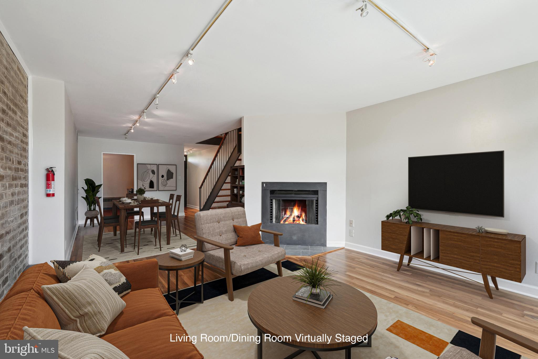 333 N Street Southwest, Unit 333 Washington, DC 20024 - Photo 6 of 29 Living Room w/ Wood-Burning FP Virtually Staged