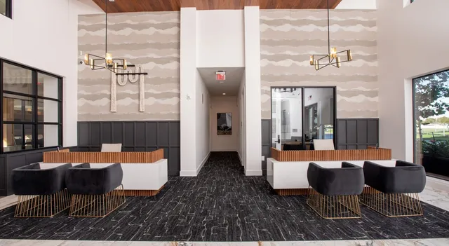 a outdoor living space with furniture and a chandelier