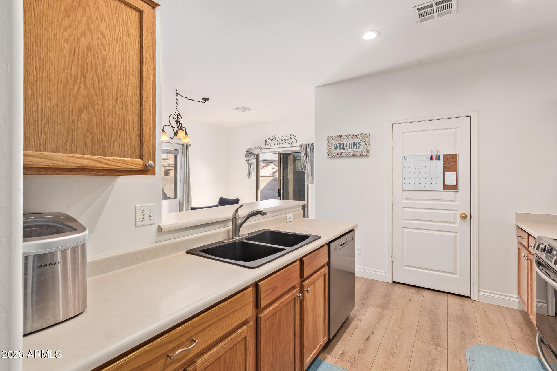 16805 West Rimrock Street Surprise, AZ 85388 - Photo 14 of 42 a kitchen with a sink and cabinets