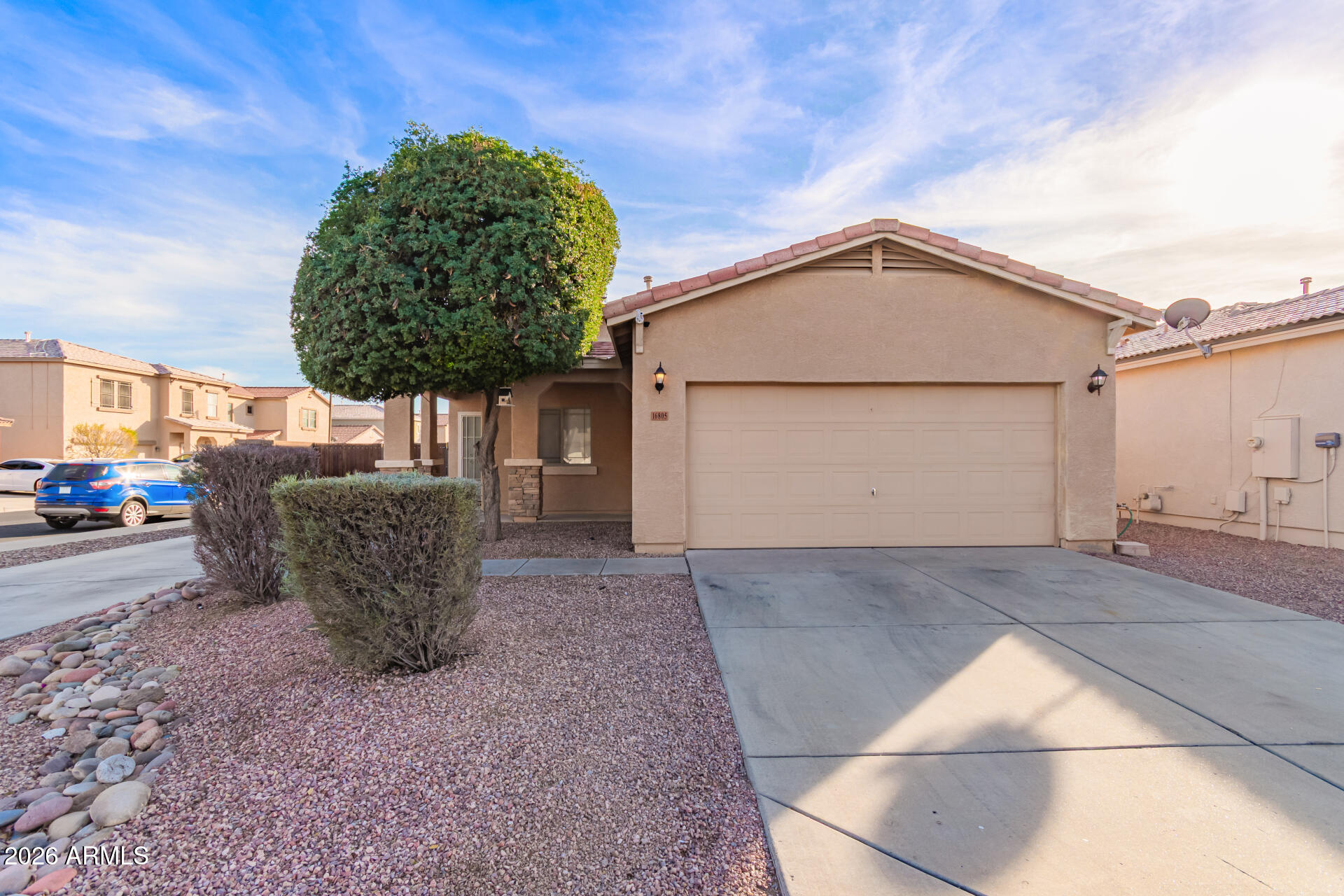 16805 West Rimrock Street Surprise, AZ 85388 - Photo 2 of 42 a view of a house with a garage