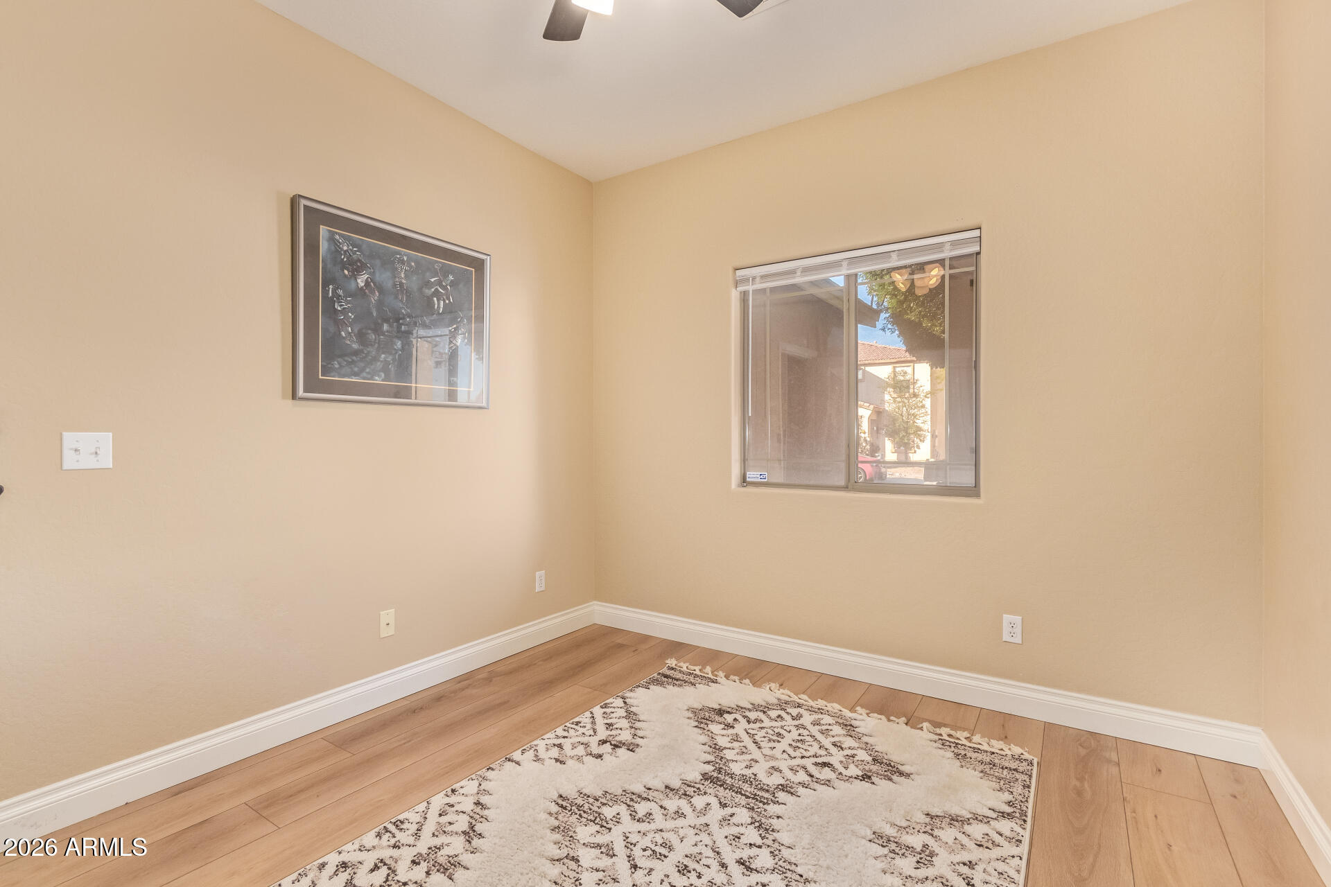 16805 West Rimrock Street Surprise, AZ 85388 - Photo 23 of 42 a view of a big room with wooden floor and a window