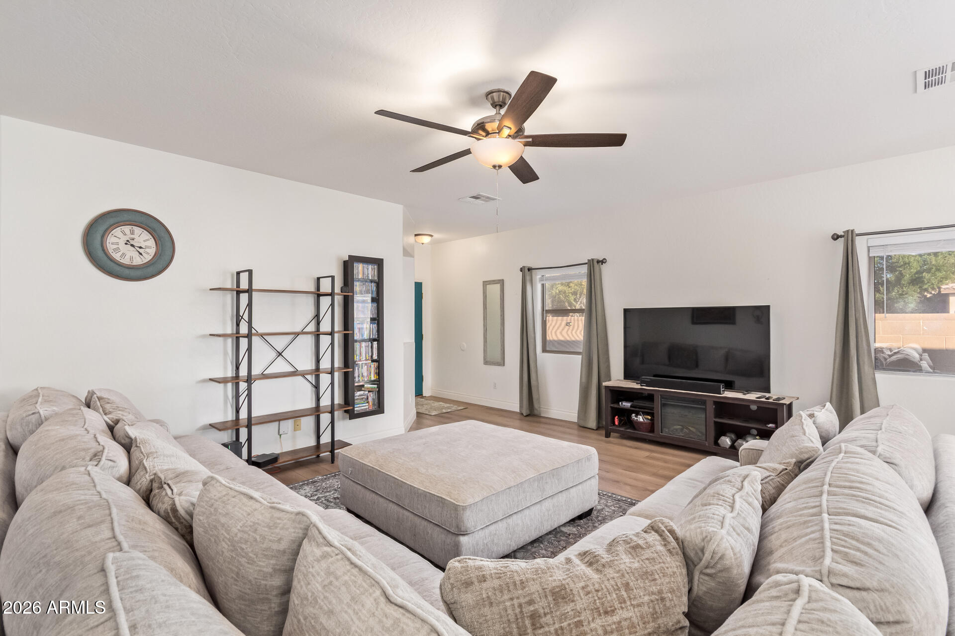 16805 West Rimrock Street Surprise, AZ 85388 - Photo 9 of 42 a living room with furniture and a flat screen tv