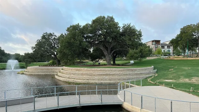 a view of a yard with large trees