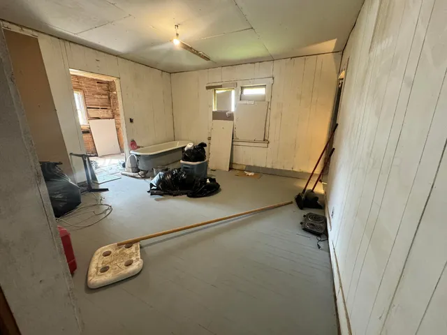 a room with furniture and gym equipment