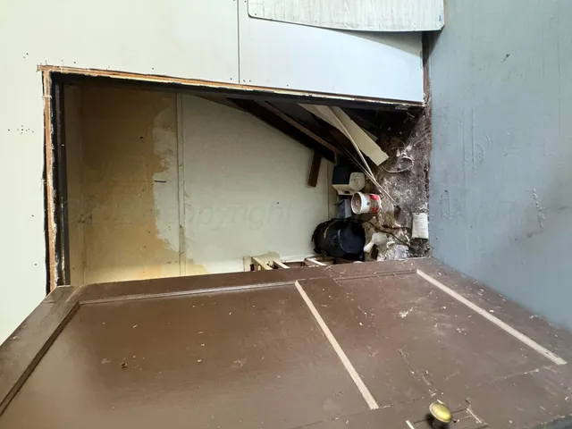 a bed room with two beds and a window