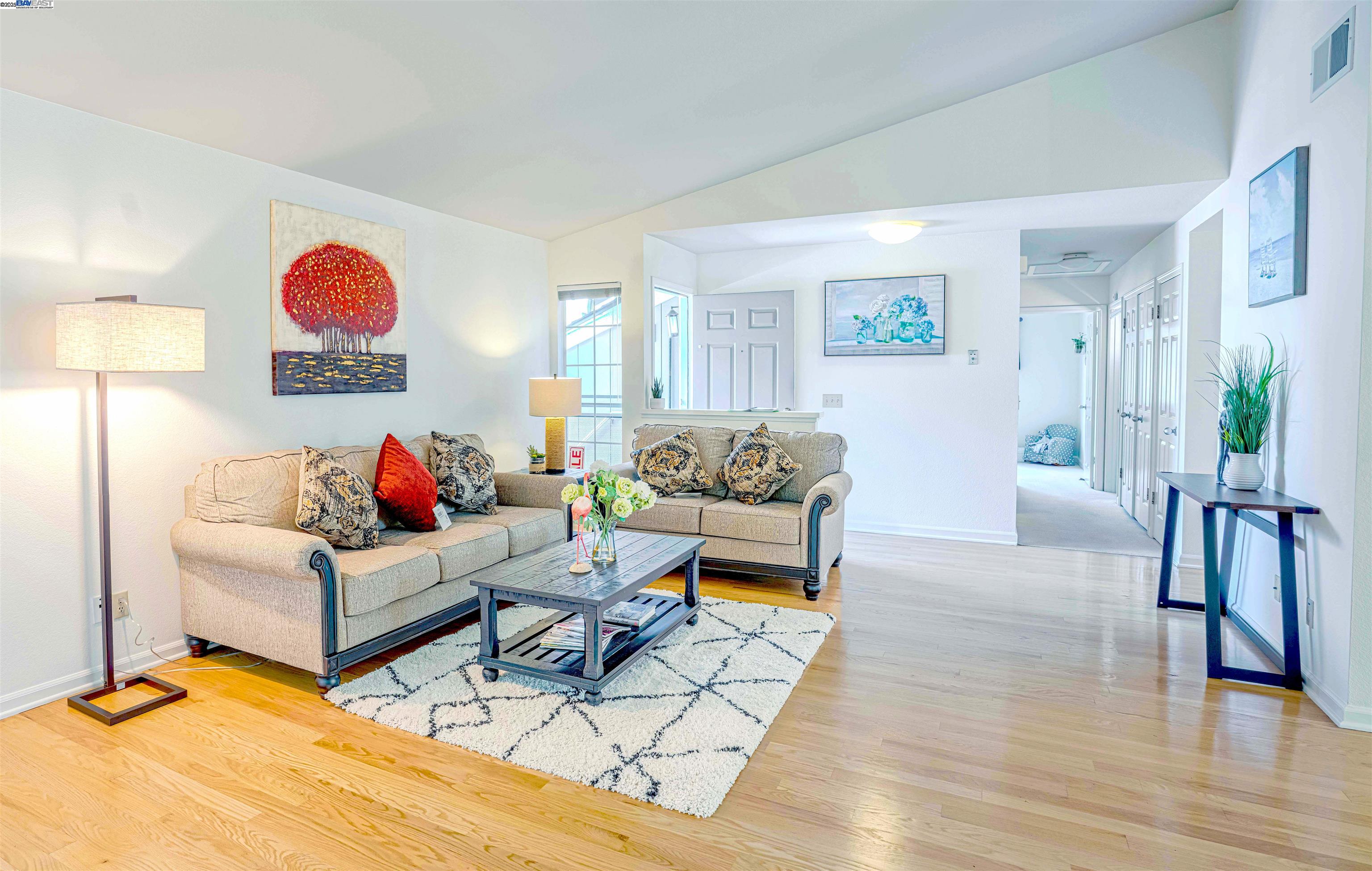 1304 University Drive, Unit 4 Menlo Park, CA 94025 - Photo 1 of 1 a living room with furniture a rug and a wooden floor