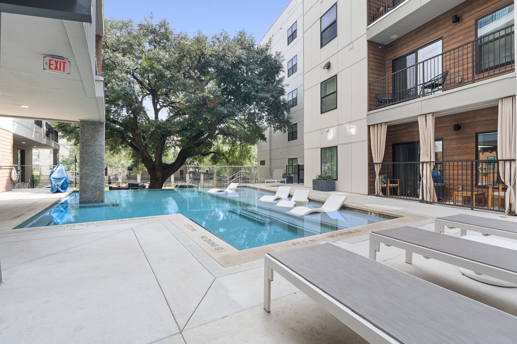 2500 Longview Street, Unit 116 Austin, TX 78705 - Photo 16 of 27 Luxurious pool overlooking the 150 year old oak tree.