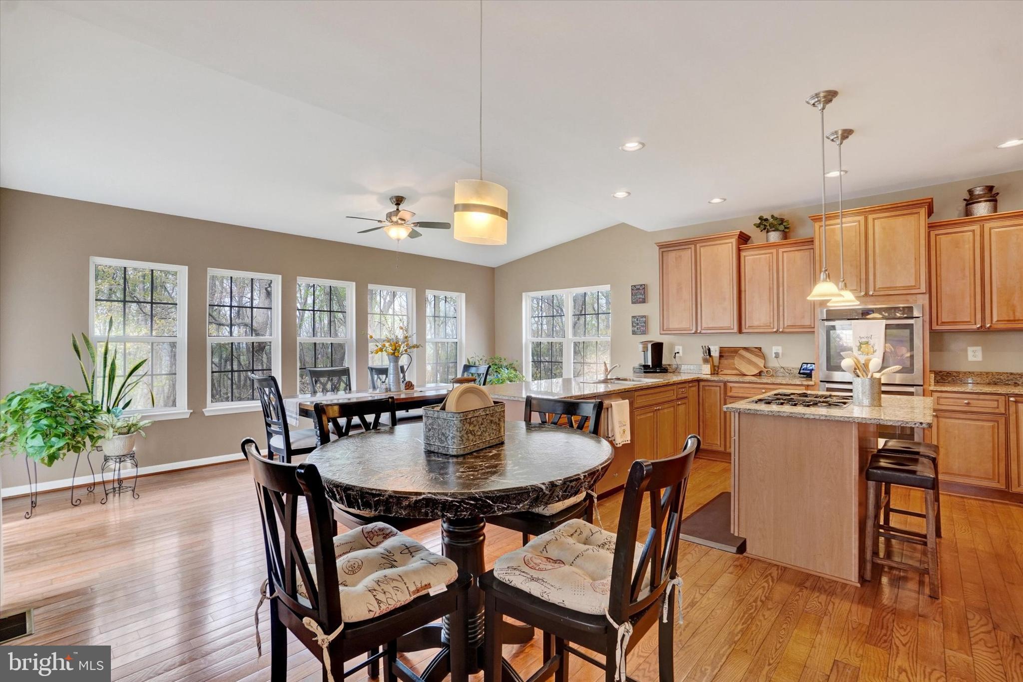 1015 Nugent Way York, PA 17402 - Photo 12 of 46 a dining room with furniture and wooden floor