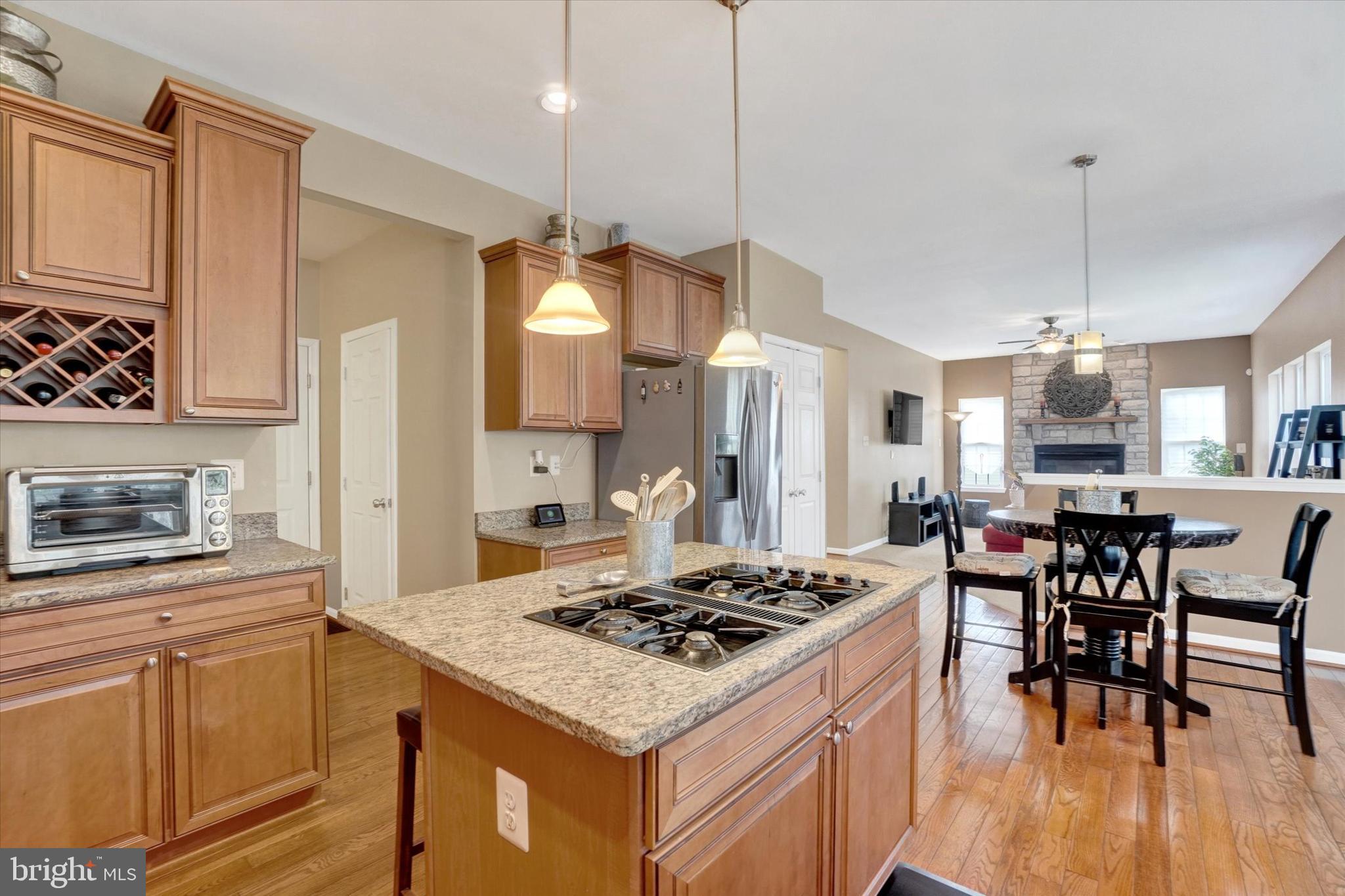 1015 Nugent Way York, PA 17402 - Photo 14 of 46 a kitchen that has a stove a table and chairs in it