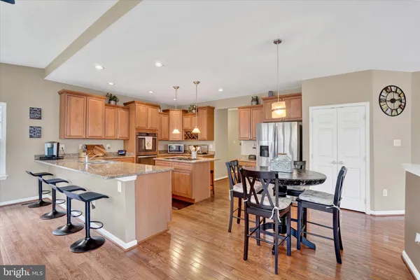 a kitchen with a table and chairs in it
