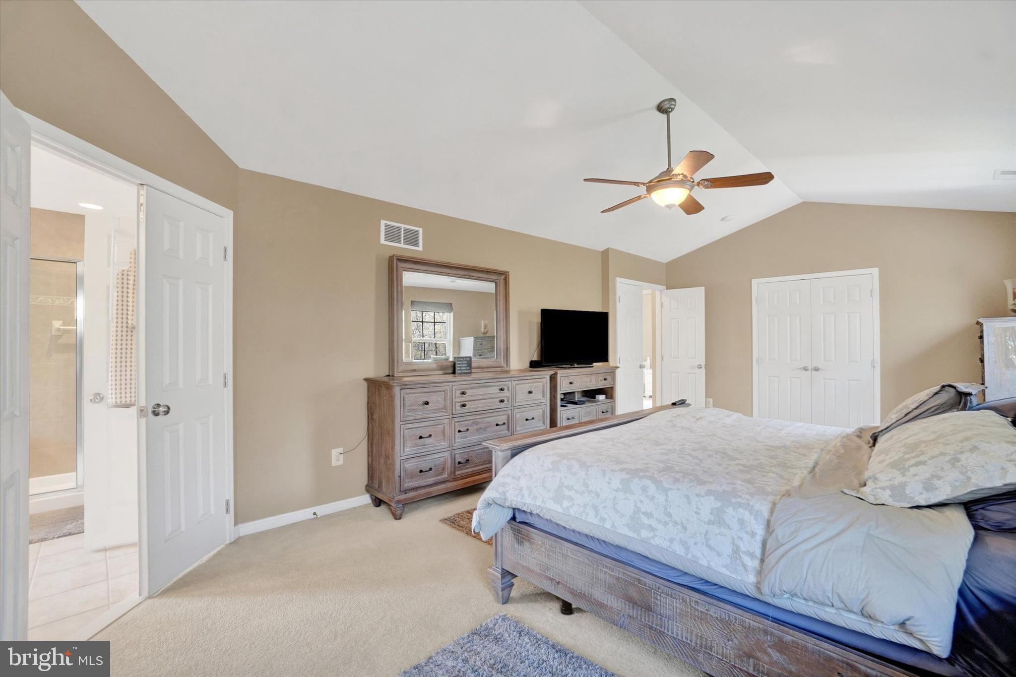 1015 Nugent Way York, PA 17402 - Photo 26 of 46 a bedroom with a bed a window and a flat screen tv