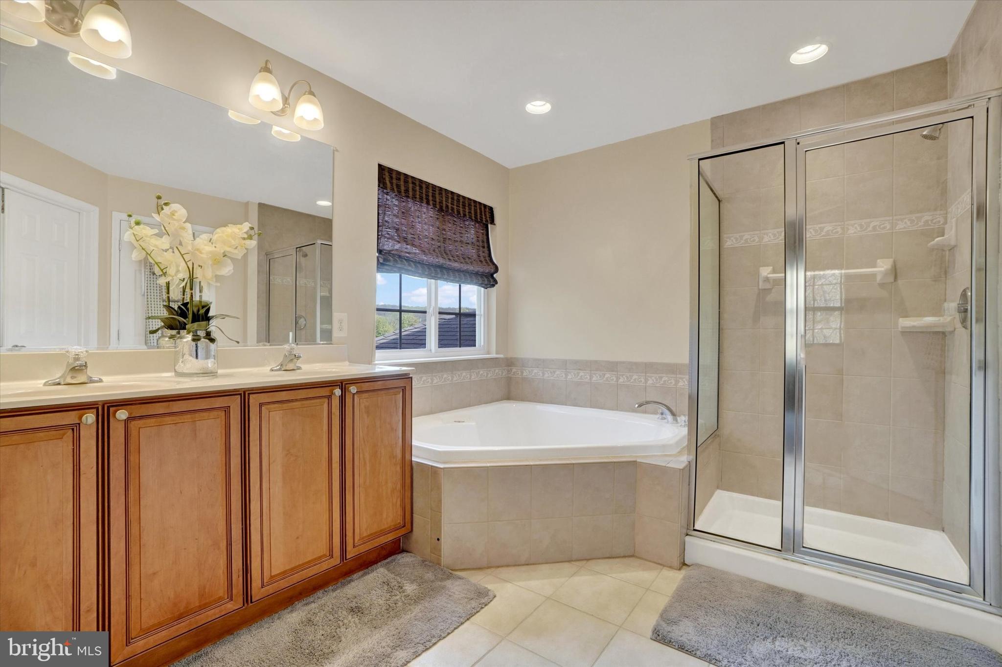 1015 Nugent Way York, PA 17402 - Photo 28 of 46 a bathroom with a bathtub shower sink mirror and toilet