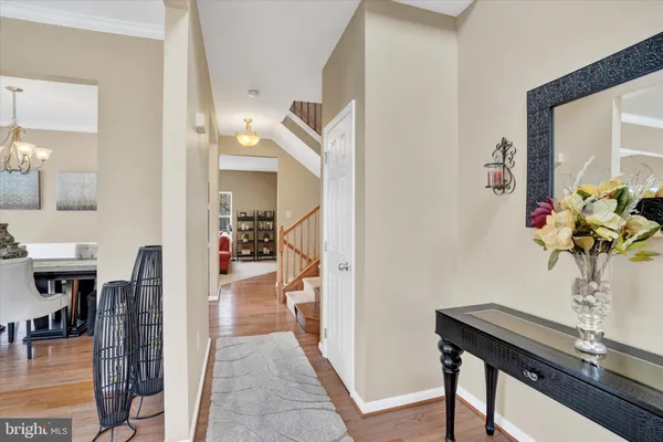 a view of a hallway with furniture