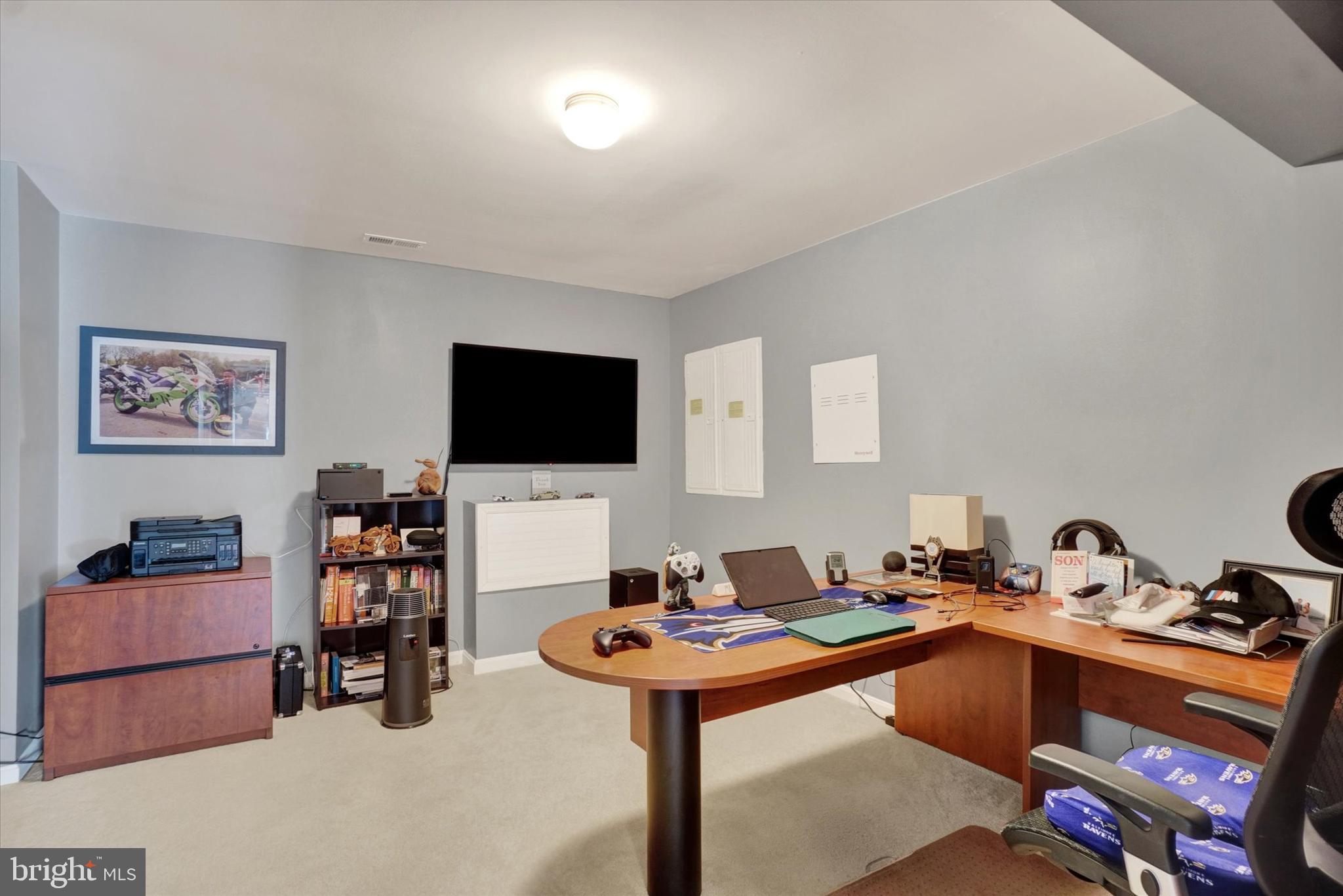1015 Nugent Way York, PA 17402 - Photo 34 of 46 a room with furniture and a flat screen tv