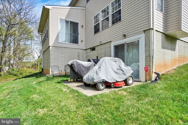 a view of backyard with a garden and entertaining space