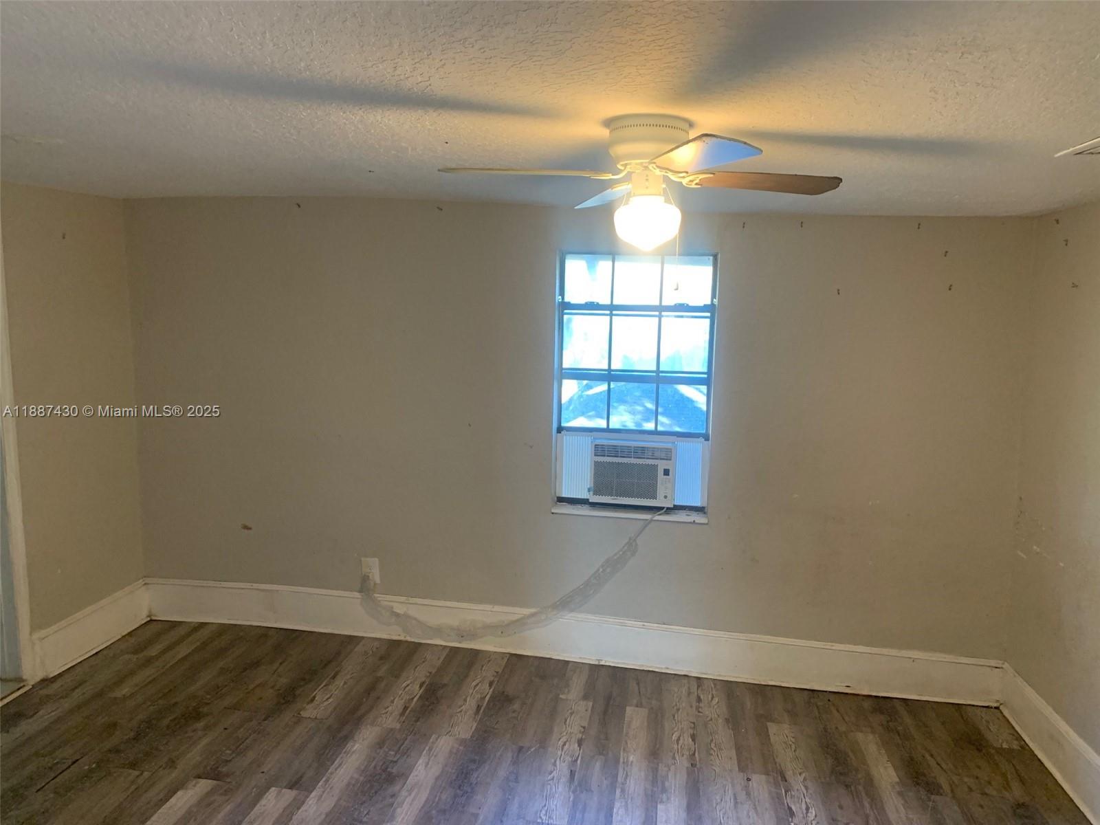 1129 Grothe Street Jacksonville, FL 32209 - Photo 17 of 21 an empty room with wooden floor and windows