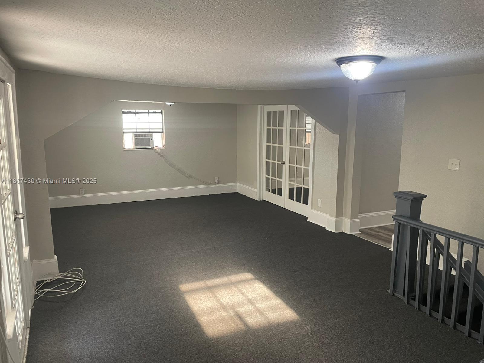1129 Grothe Street Jacksonville, FL 32209 - Photo 2 of 21 an empty room with windows