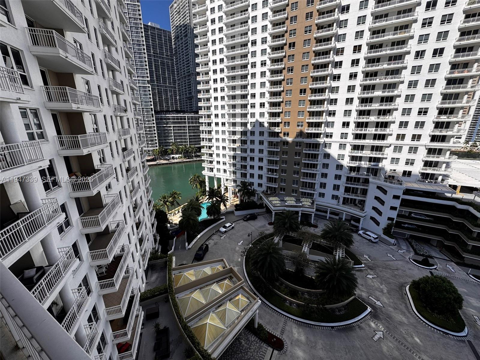 701 Brickell Key Boulevard, Unit 1208 Miami, FL 33131 - Photo 2 of 14 a bathroom with a sink and a mirror