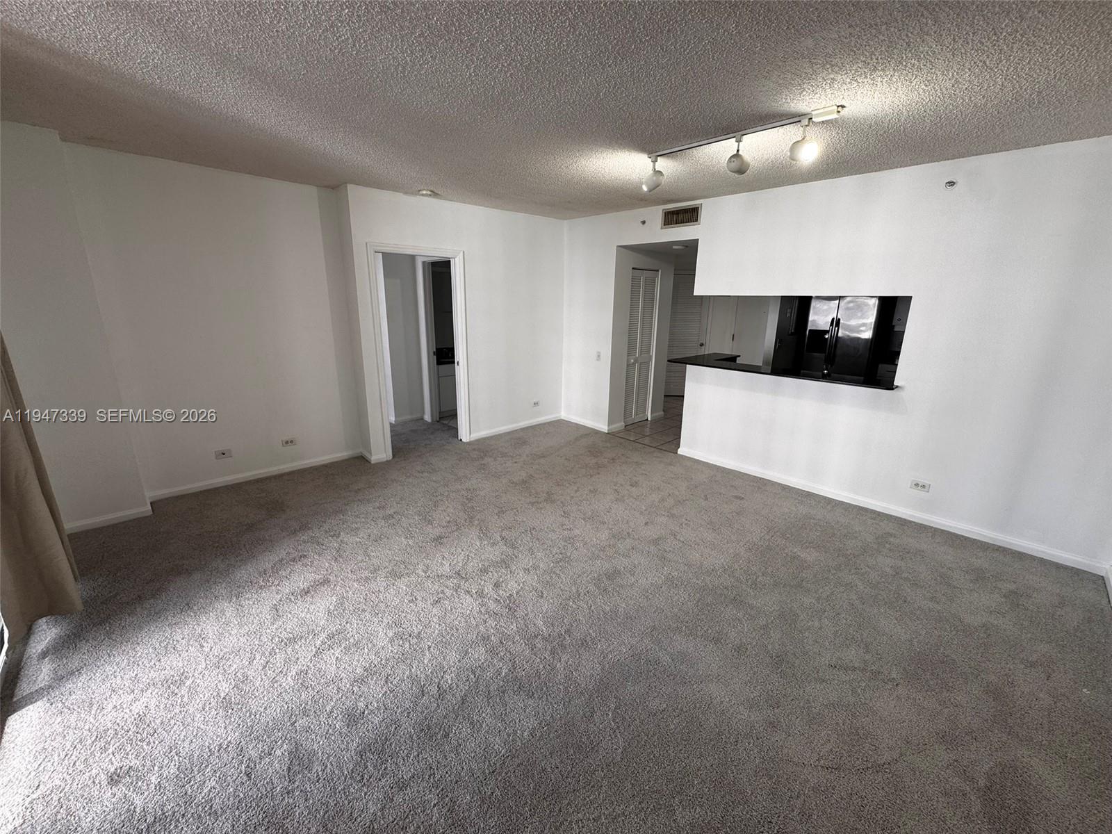 701 Brickell Key Boulevard, Unit 1208 Miami, FL 33131 - Photo 5 of 14 a view of an empty room